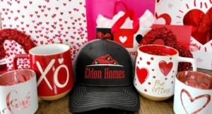 Eldon Homes cap surrounded by Valentines Day mugs